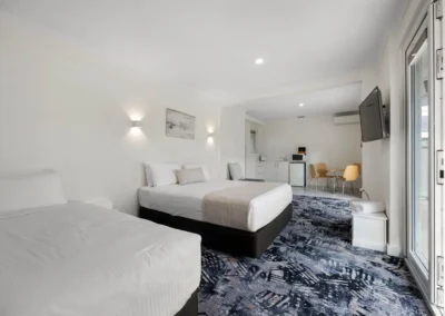 Cosy Deluxe Queen room at Best Western Adelaide Airport Motel, showcasing a stylish interior with a comfortable queen bed, modern decor.